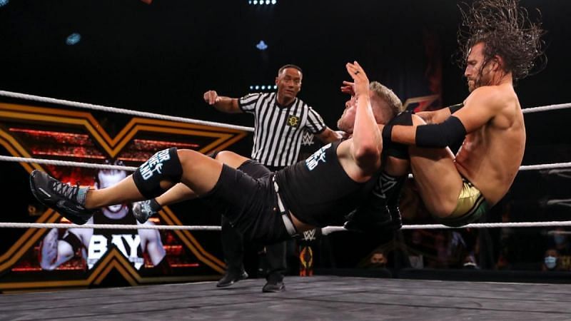 Adam Cole facing Pat McAfee